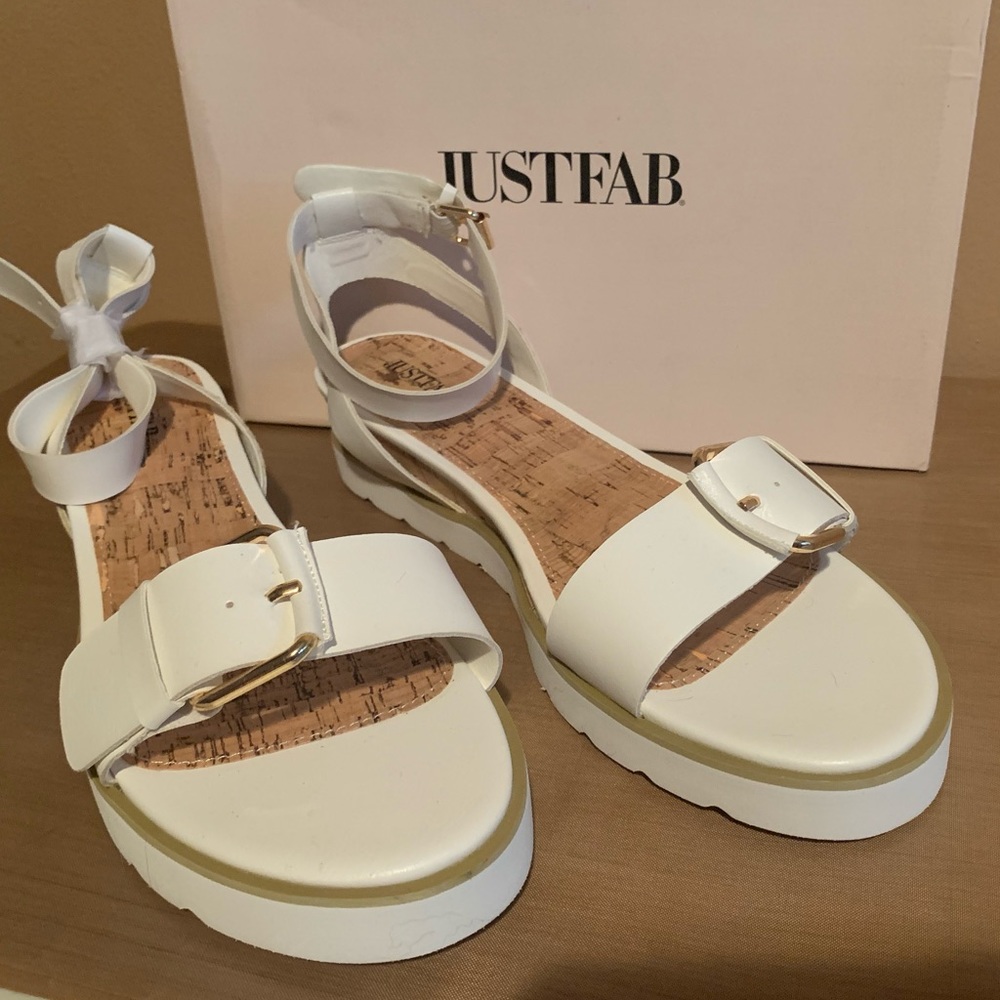 Beautiful white sandals. Never been worn!